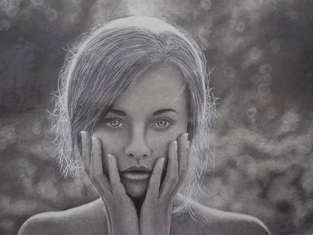 Pencil portrait of a young woman with her hands on her cheeks