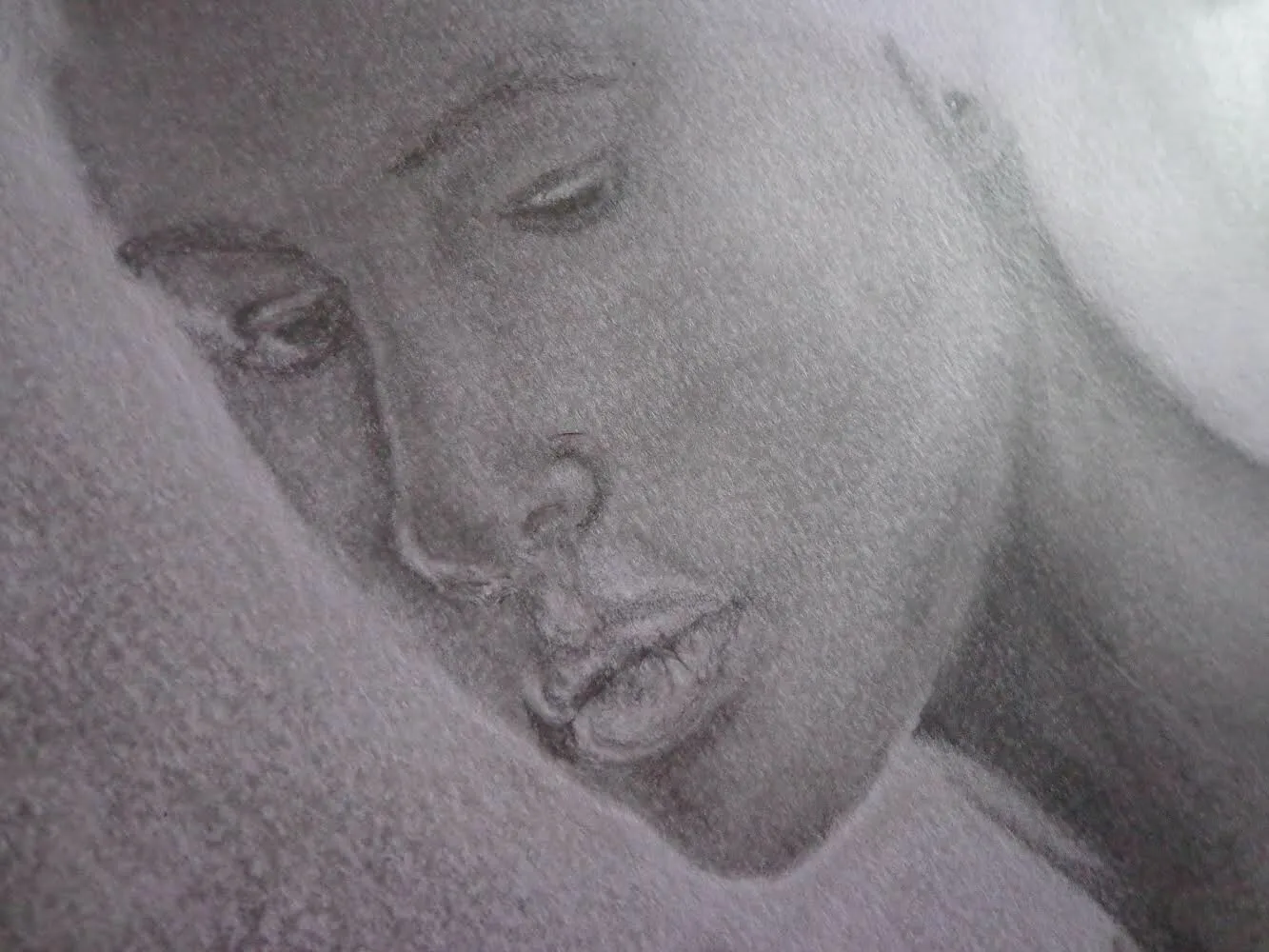 Pencil drawing of a face resting in sleep