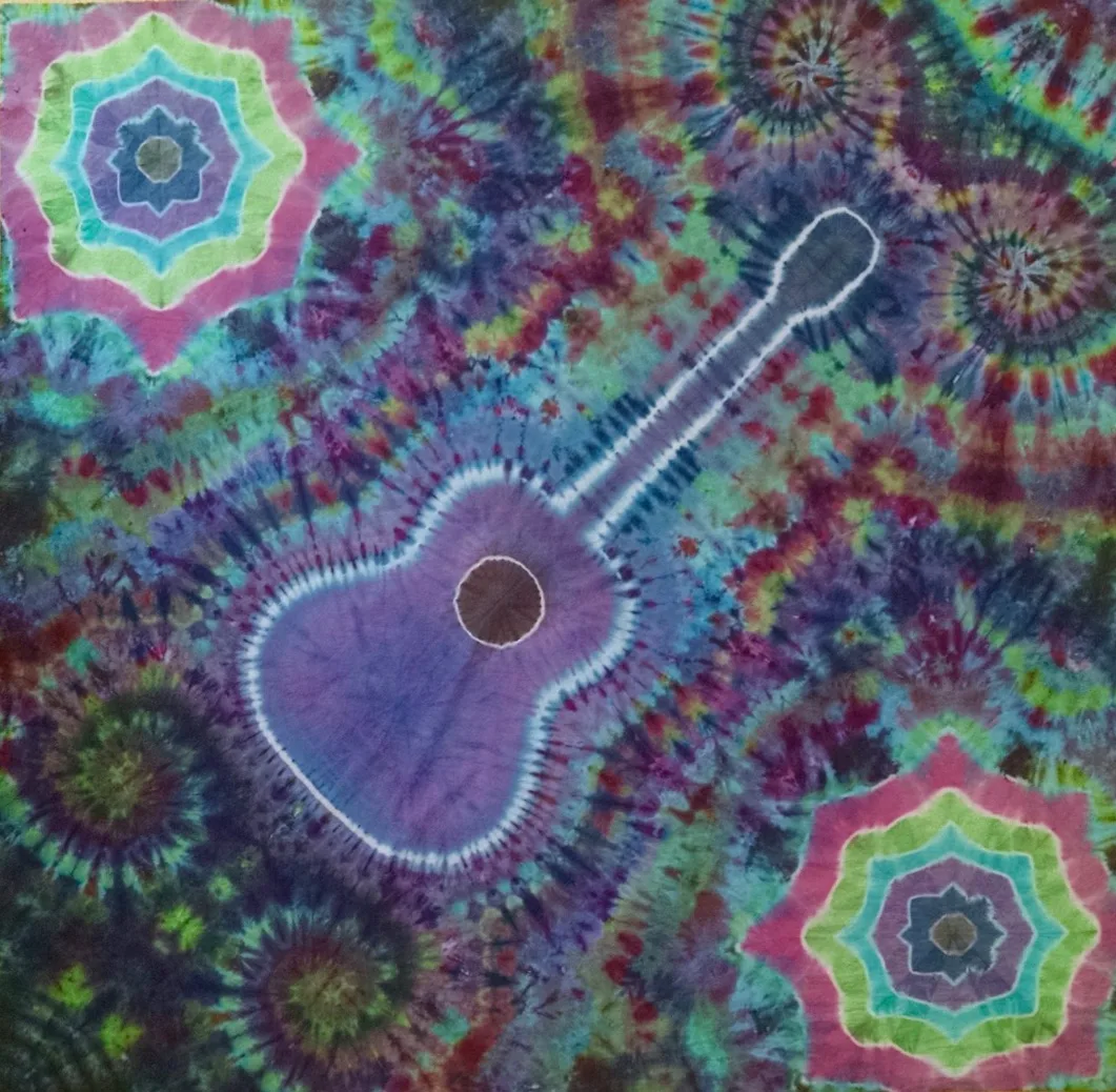 Tie-dye tapestry with an acoustic guitar outline and mandala corners