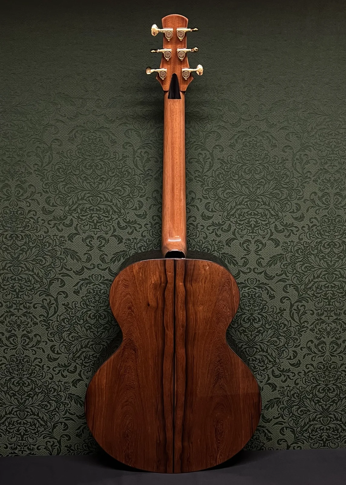 Back of Build No. 001: two-piece back with dark heartwood stripes down the center seam, and the neck