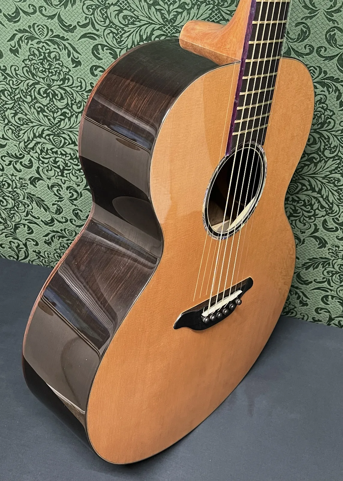 Build No. 001 at an angle, showing the dark glossy sides and the cedar top